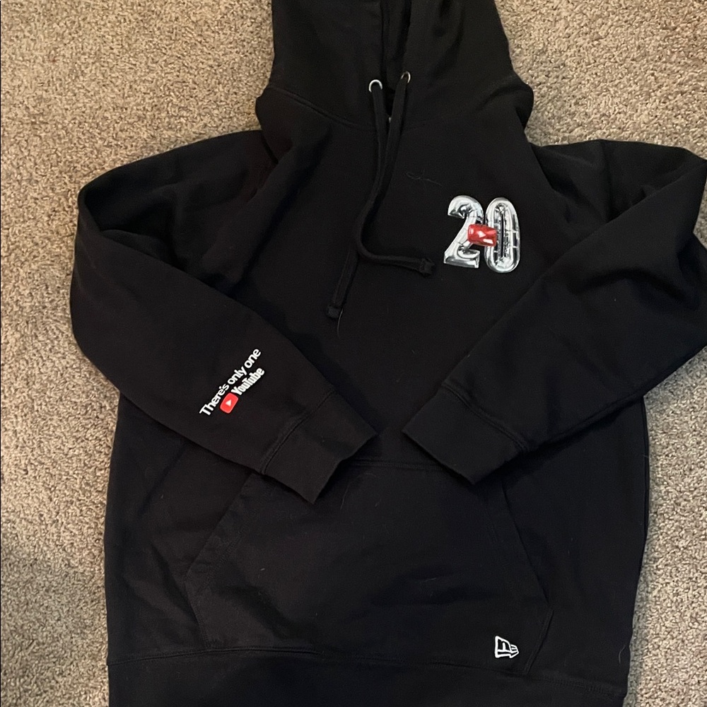 New Era Black Hoodie with Embroidered Logo
YouTube anniversary